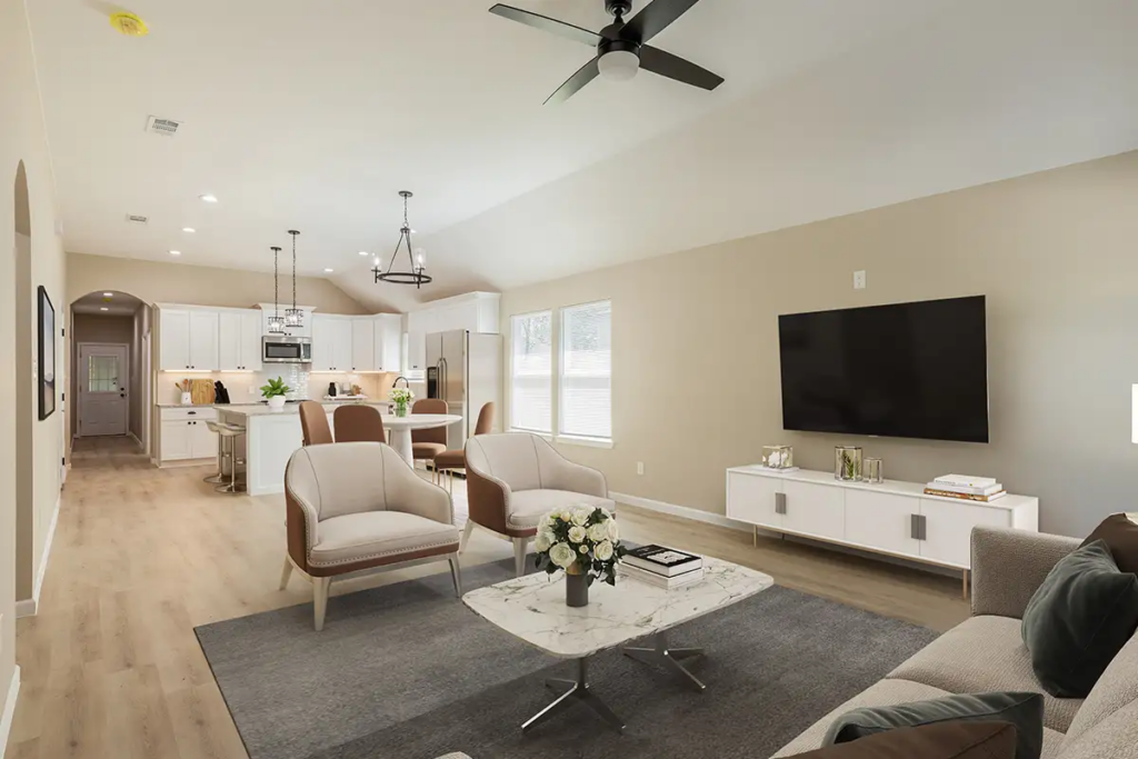 Modern finished basement with open living area, wall-mounted TV, and seating arrangement