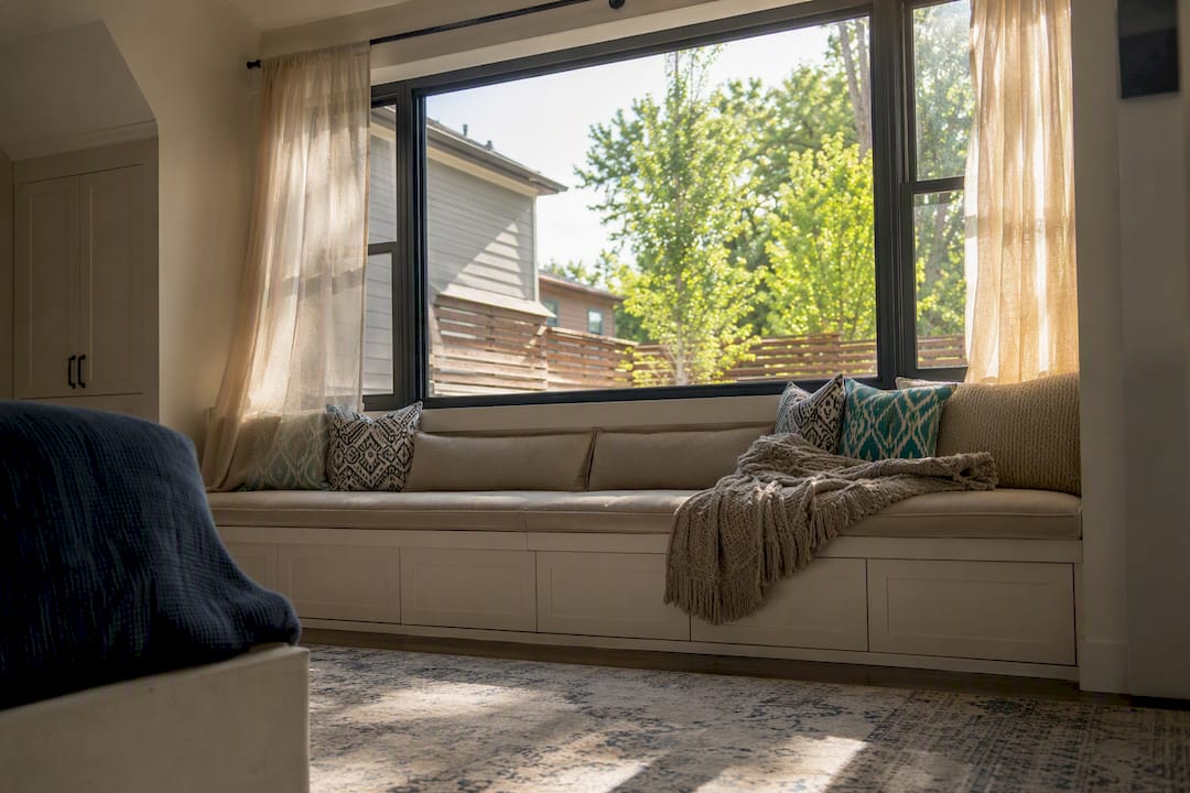 Bright guest suite with egress window and window seat