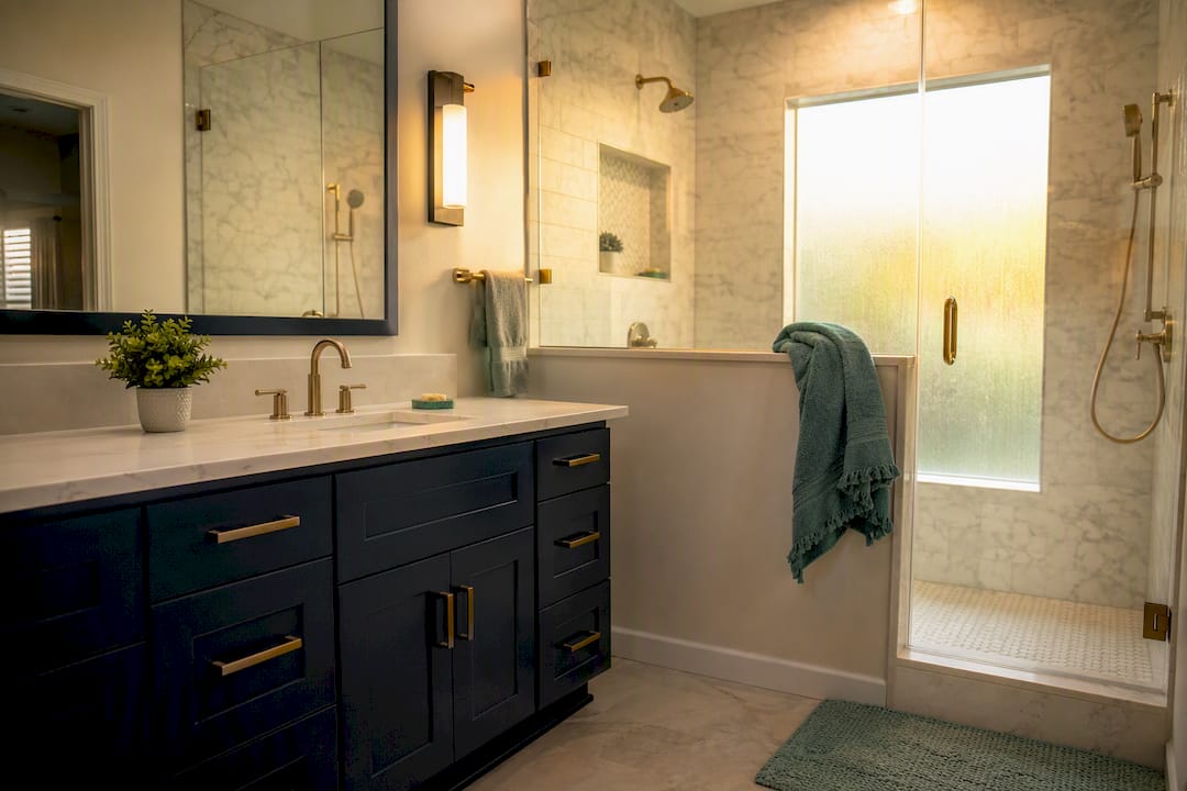 Remodeled bathroom vanity and tiled shower