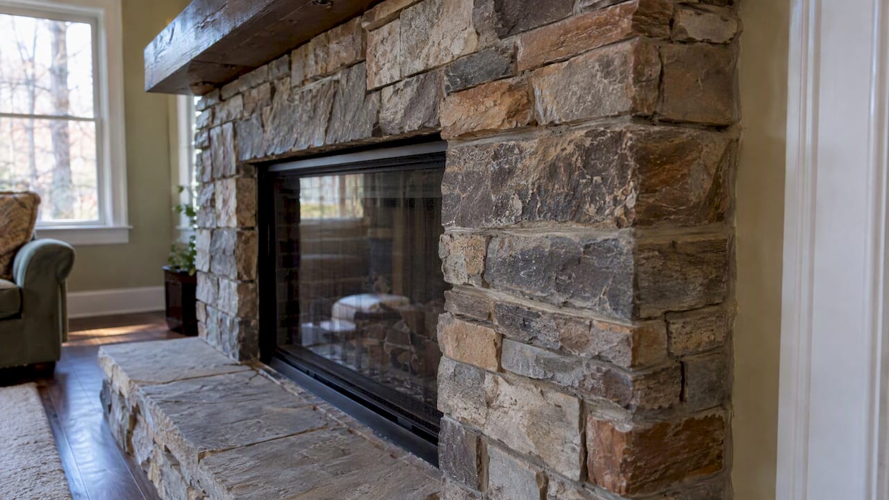 Layered stacked stone around a fireplace